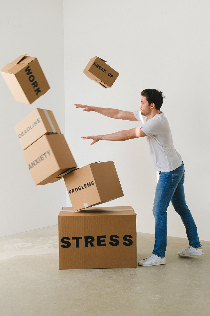 Man throwing boxes in stress