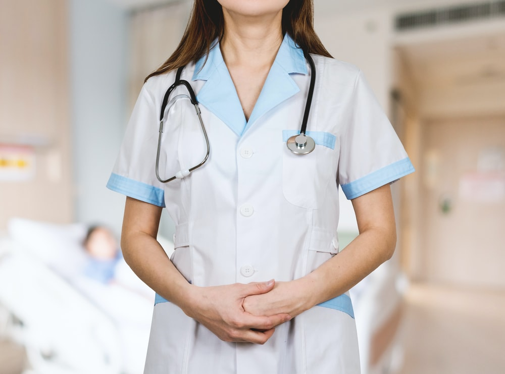 a doctor standing with a stethoscope 