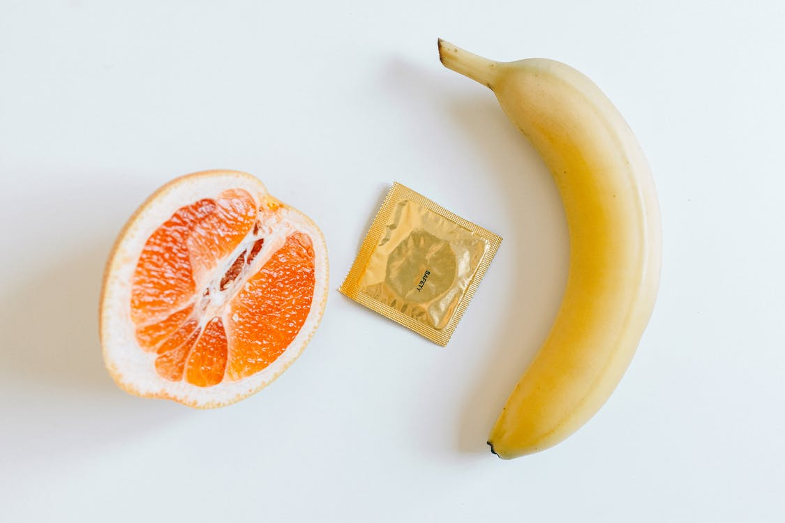 a condom with fruits on a table