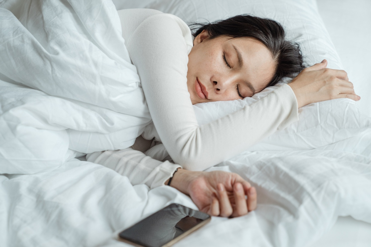 woman sleeping on her bed