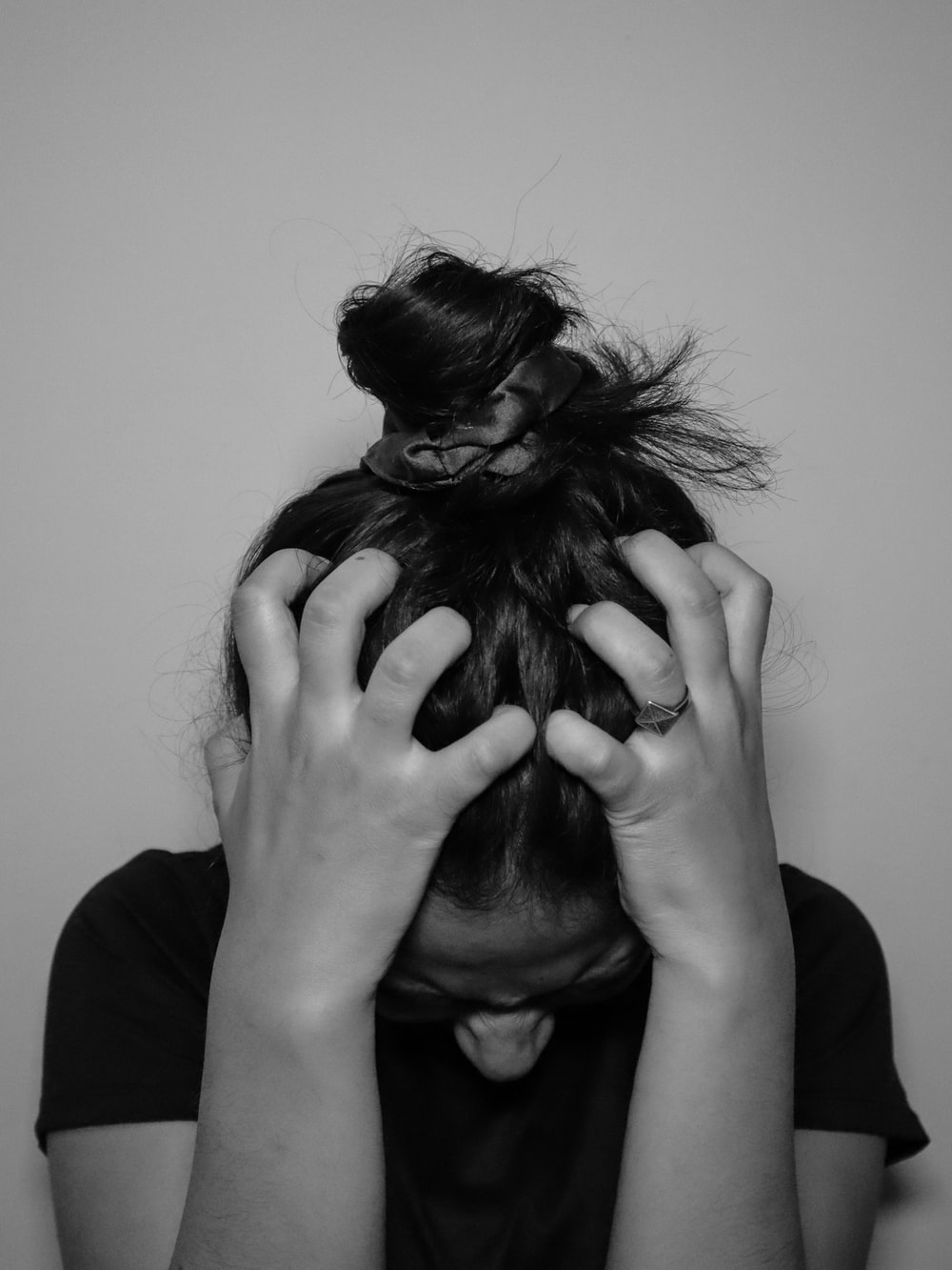 a girl holding her head