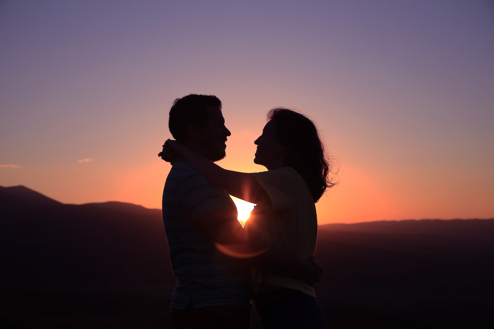 silhouette of a hugging couple