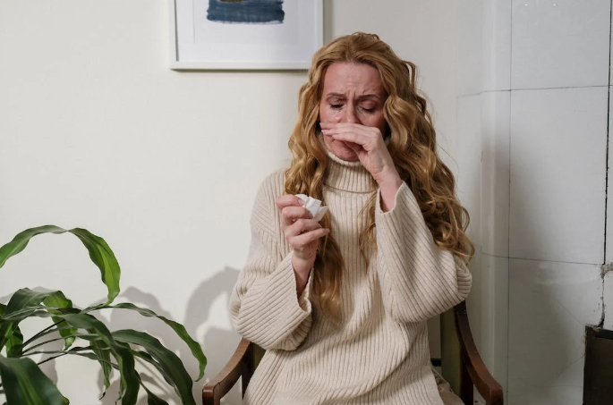 Woman suffering from allergies. 